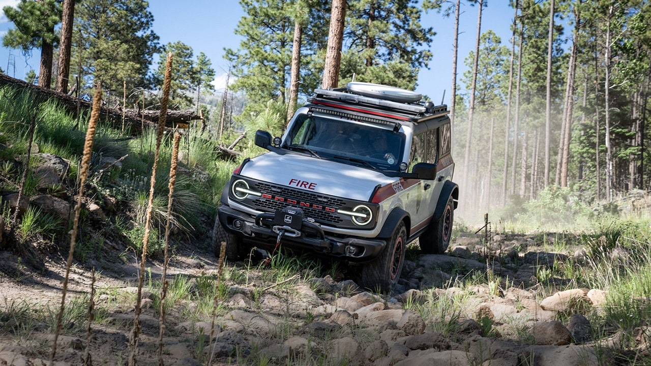 Bronco® Badlands® model with the Sasquatch® Off-Road Package being driven through a forest