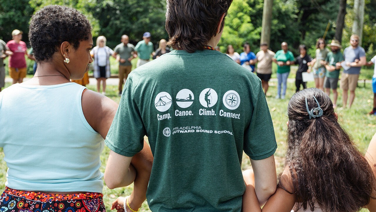 People engaging in a circle activity.
