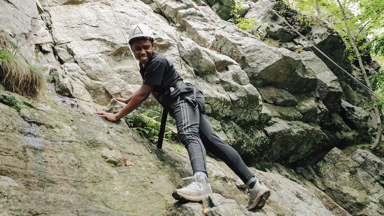 Outward Bound student rock climbing