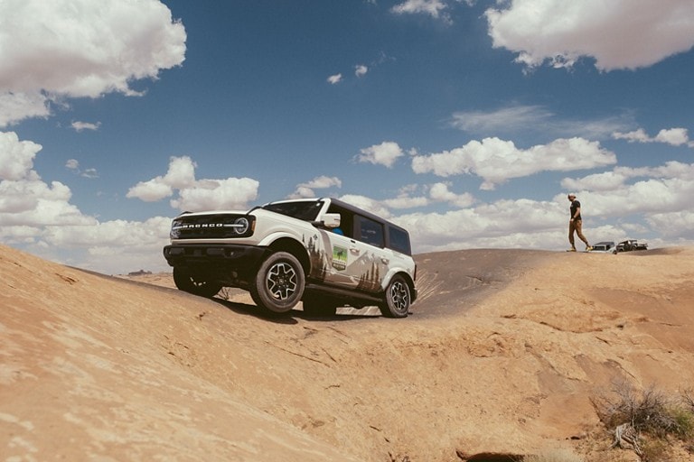 A Bronco® SUV on a desert slickrock trail.