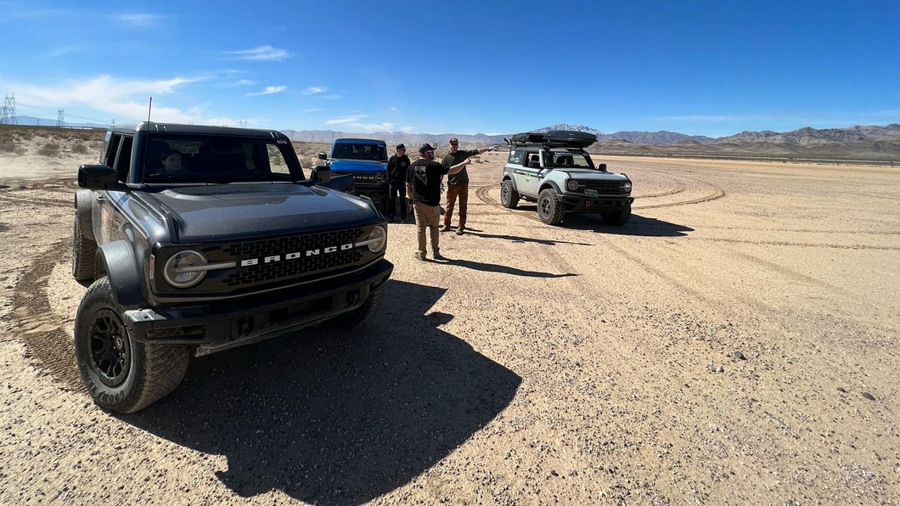 Bronco® SUVs parked in a desert