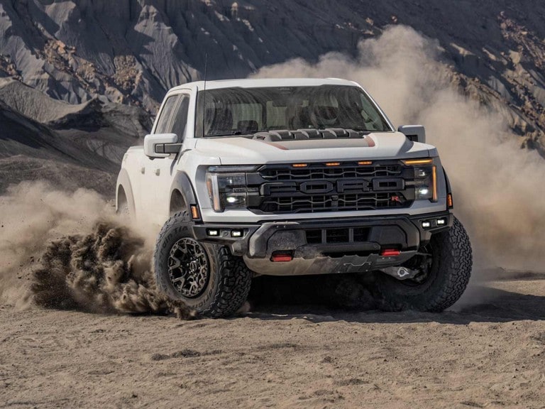 An F-150 Raptor R™ in a dusty desert environment
