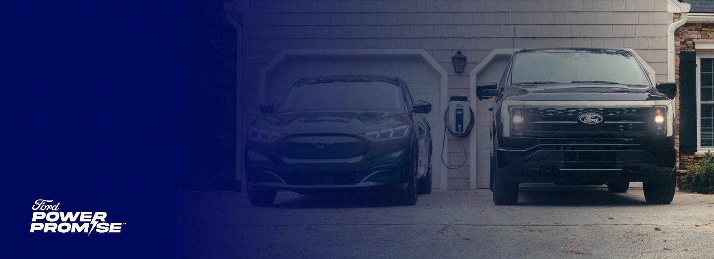 A Ford Mustang Mach-E® and a Ford F-150 Lightning® outside a garage with a Ford Power Promise logo overlaid