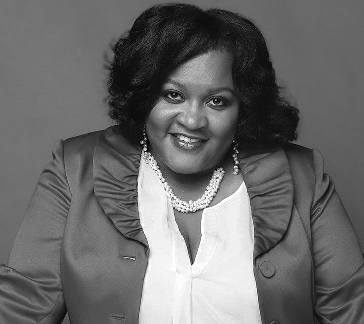 A close-up black and white portrait of Lucretia Williams, a woman innovator at Ford. Rollover of the photo enlarges her photo slightly. Clicking her photo takes you to her professional bio.