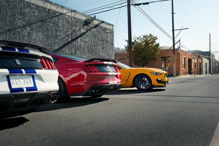 A lineup of three 2019 Ford G T three fifties parked in a lot