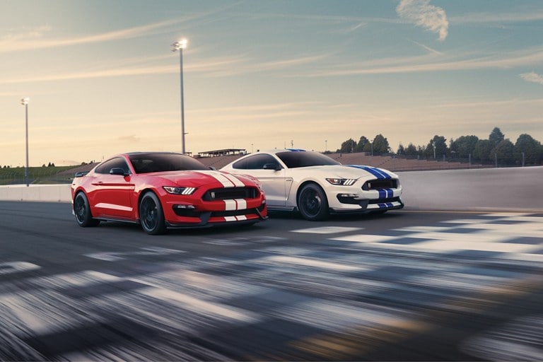 A pair of 2019 Ford G T three fifties side by side on a track
