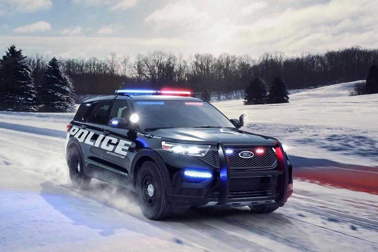 The ford police interceptor utility on a snowy road