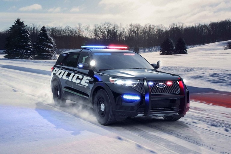 The ford police interceptor utility on a snowy road