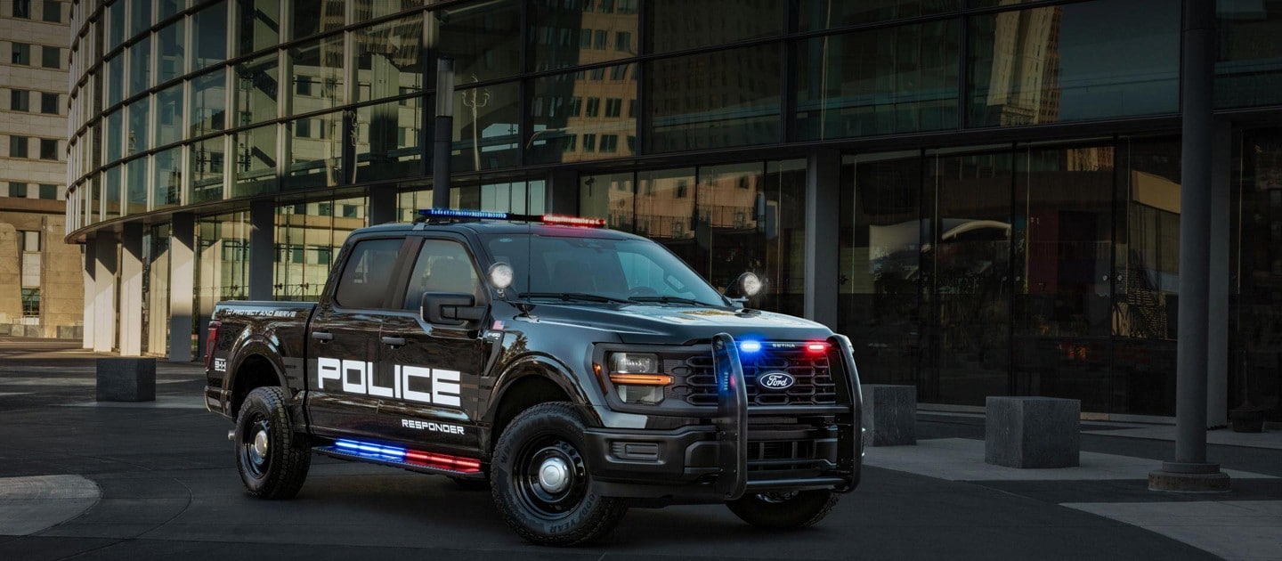 2024 Ford F-150® Police Responder with lights flashing parked in the middle of a city street