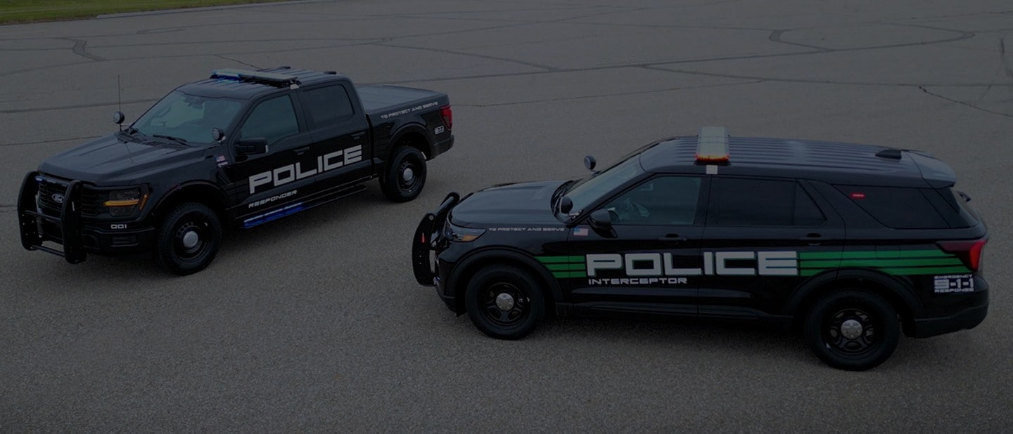 A Ford F-150 Police Responder truck and Interceptor SUV parked in an open lot