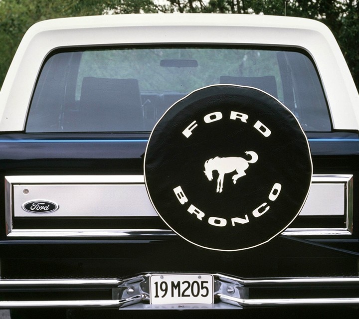 1984 Ford Bronco highlighting the rear of the vehicle with ford bronco tire cover