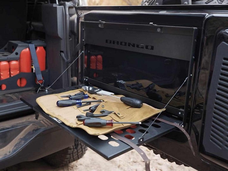 A roll-up tool set, opened and displayed on a Ford Bronco® cargo shelf.