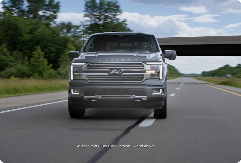 Still image from a video showing the front of a truck driving down the highway