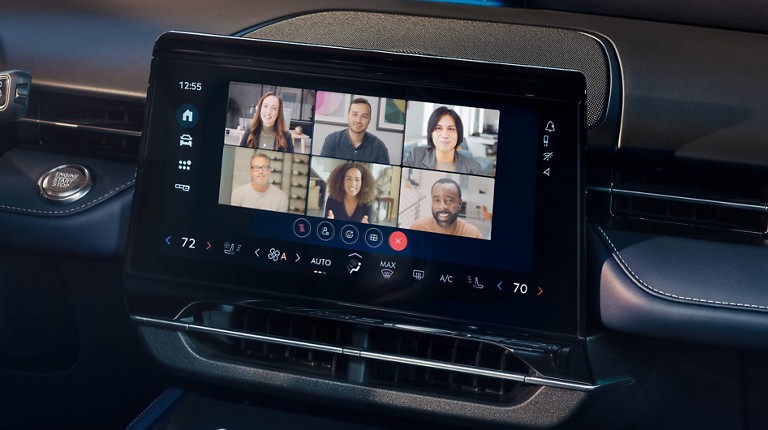 A Ford vehicle technology screen displaying a Webex video conferencing call with others. Screen may vary.