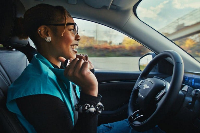 A Ford Mustang Mach-E® SUV being driven in Hands-Free mode while on a Blue Zone highway.