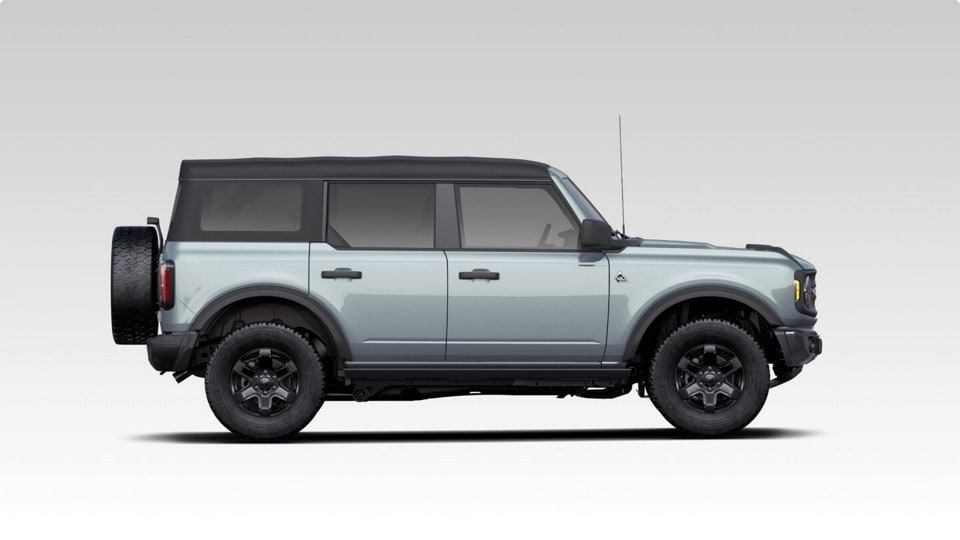 Photo illustration of the side view of a gray 2024 Ford Bronco® Black Diamond SUV.