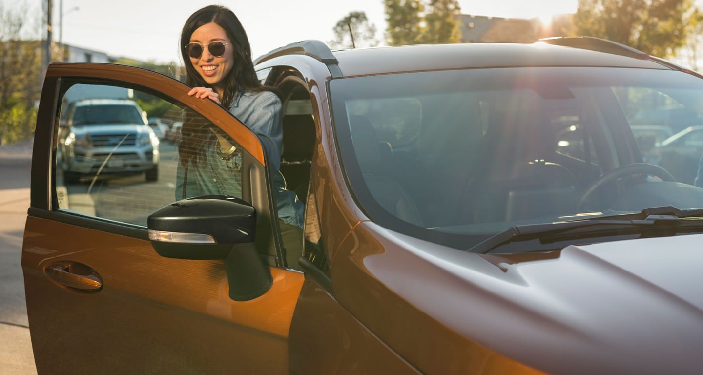 Women getting out of the passenger side of a ford explorer