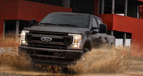 Black Truck driving through water