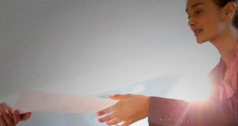 Woman reaching out to receive document