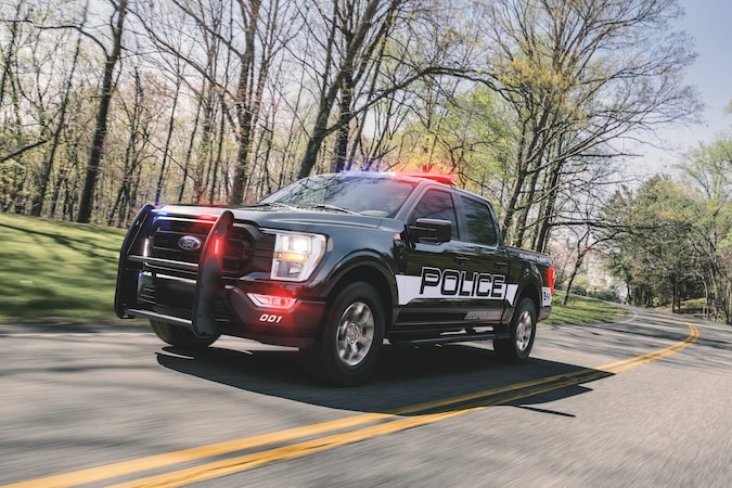 F150 Police Responder driving on road through trees