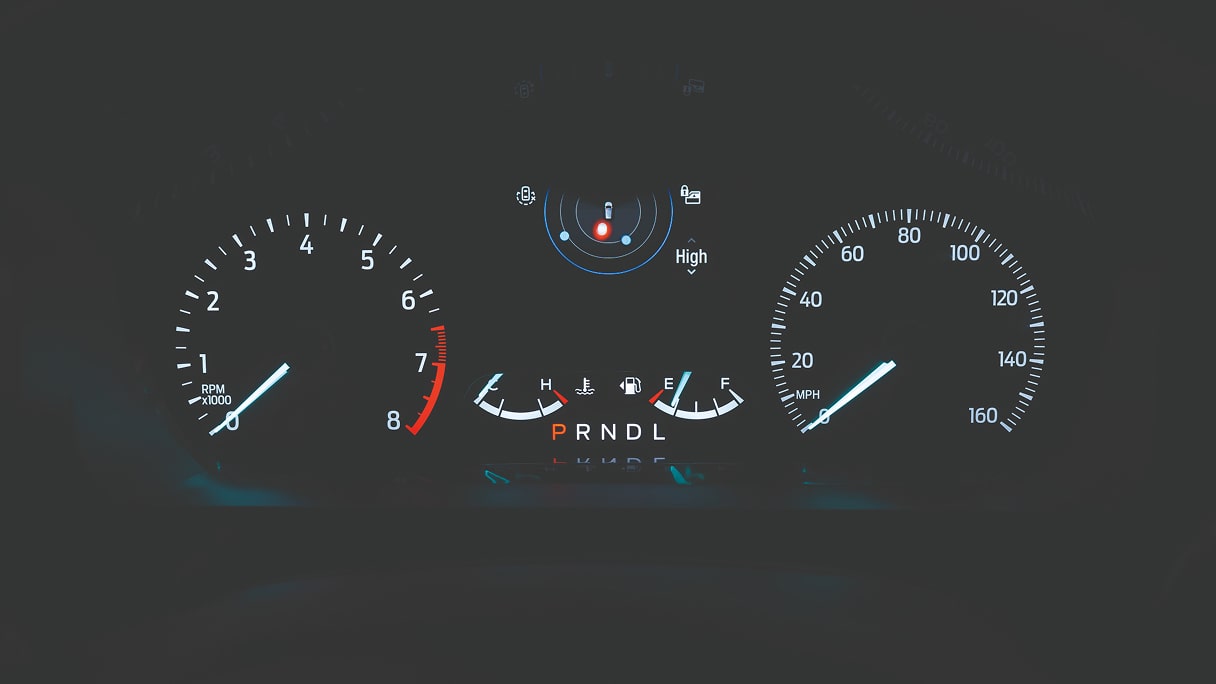 A digital gauge cluster inside a Ford vehicle 