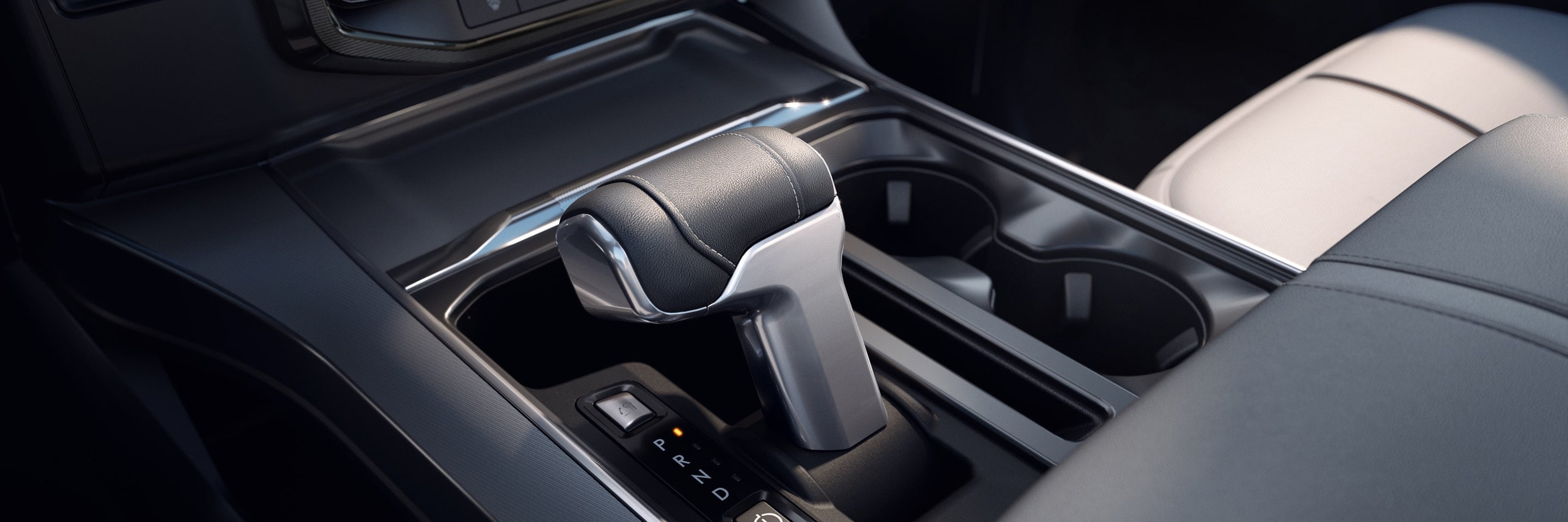 A Ford vehicle gear shifter and center console close up. 