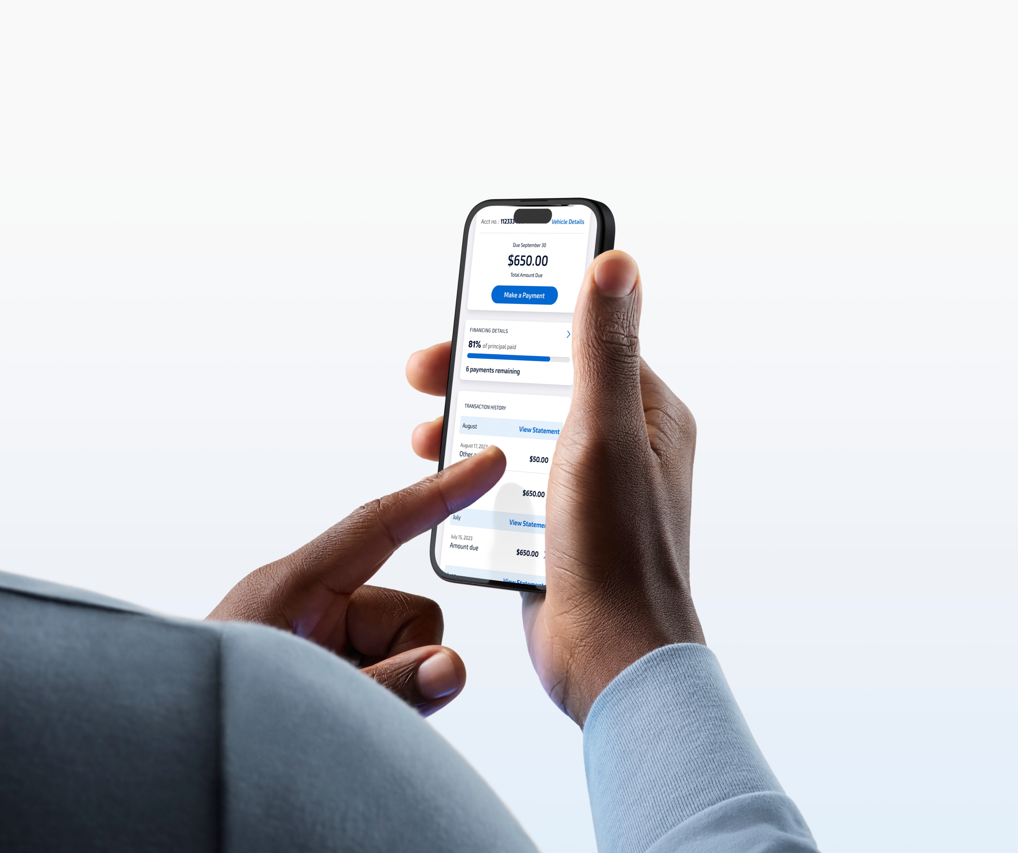 Hands of a man holding a cellphone and touching the screen