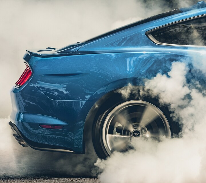 2023 Ford Mustang® coupe rear wheels showing a burnout being performed