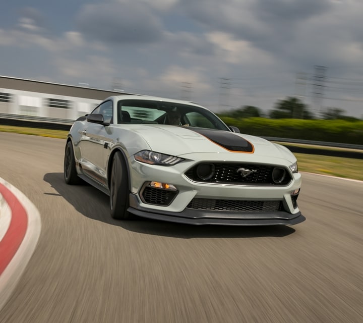 A 2021 Ford Mustang Mach 1 being driven on a track