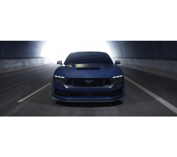 2024 Ford Mustang® Dark Horse™ model being driven through a highway tunnel