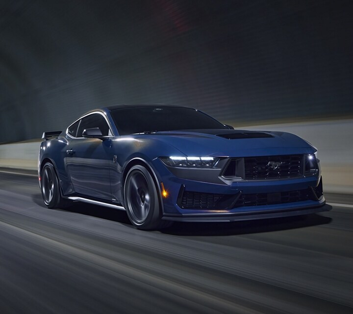 2024 Ford Mustang® Dark Horse™ model being driven through a dark tunnel