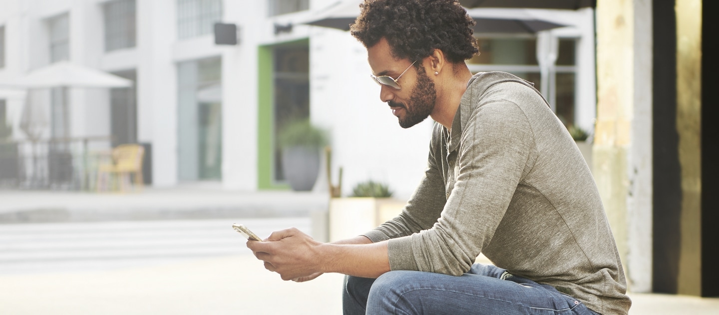 Person shopping for vehicles on their phone