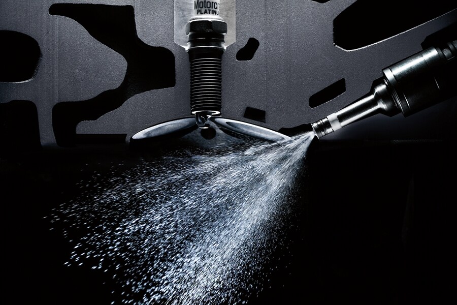 Close up view of direct fuel injection spray in a 3 point 5 liter EcoBoost engine