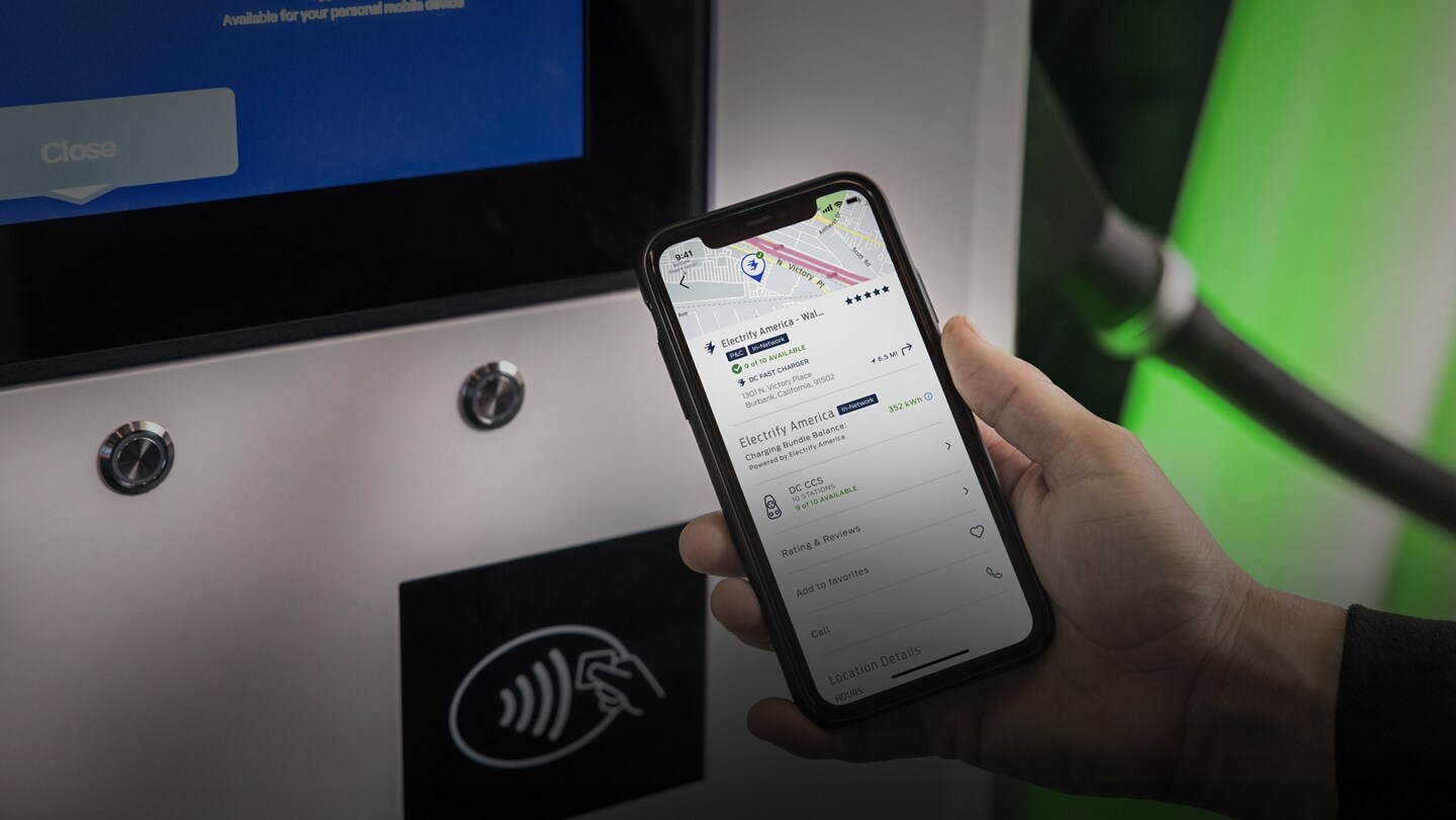 A smartphone shown initiating a charge session at a Blue Oval Network charging station