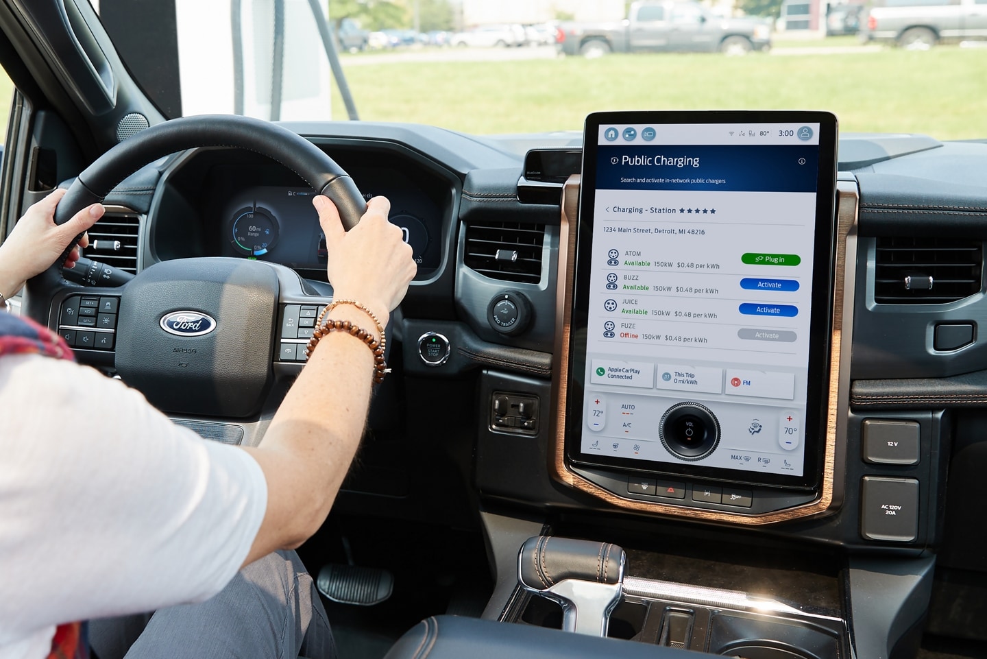A driver uses the Charge Assist feature from his 2023 Ford F-150 Lightning® touchscreen