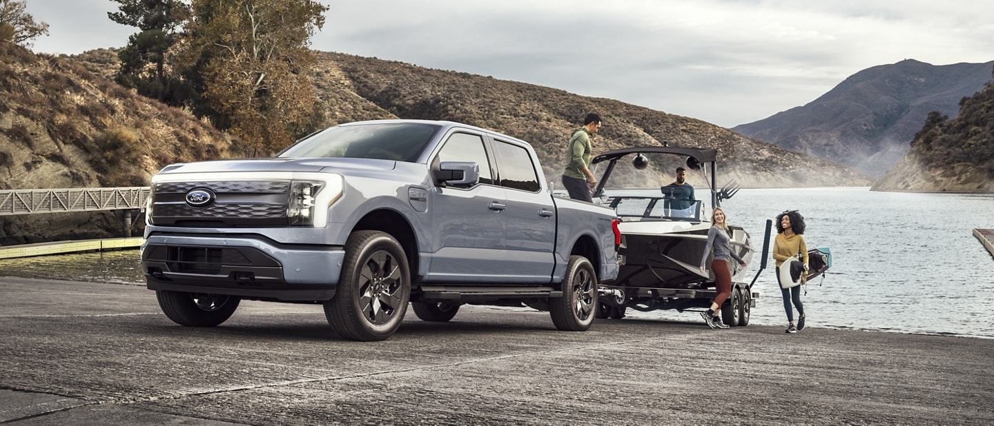 2023 Ford F150 Lightning towing a boat out of the water.