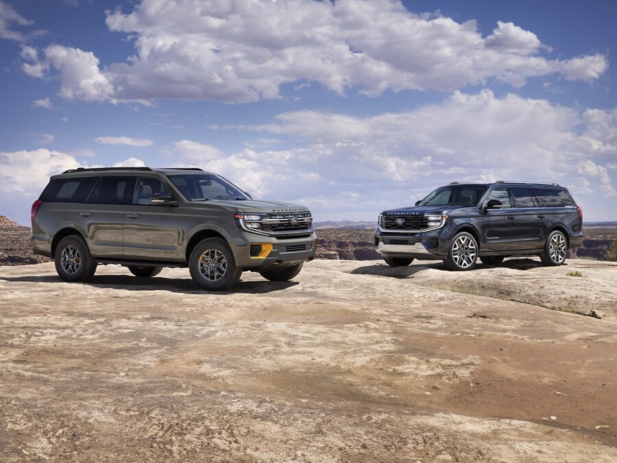 A 2025 Ford Expedition® Tremor® and Expedition® Platinum® Ultimate Package model parked on a rocky outcrop