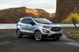 2020 Ford EcoSport in Moondust Silver parked by a mountain river