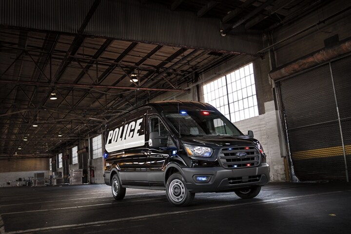 The twenty twenty ford transit prisoner transport vehicle parked in a garage
