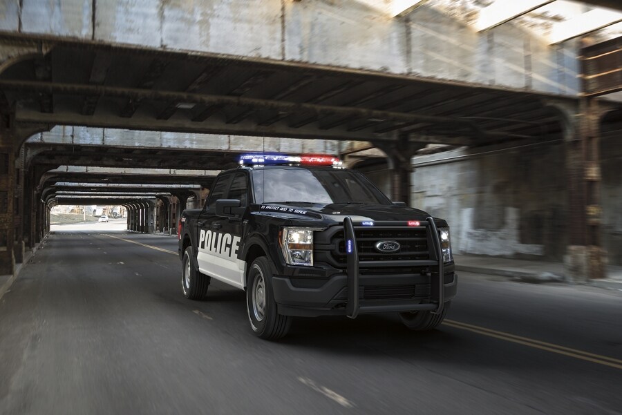 Twenty twenty one ford f one fifty special service vehicle being driven under a bridge