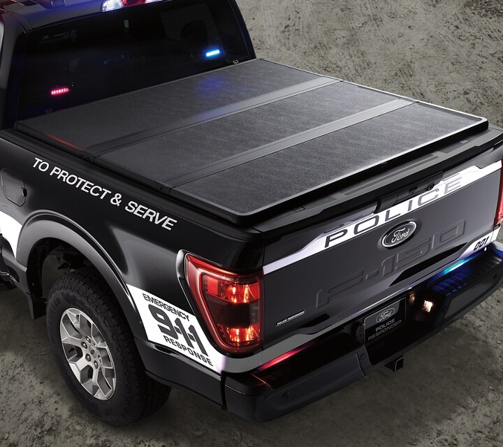 The bed of an f 1 50 police responder with a tonneau coverkey fob of an f 1 50 police responder