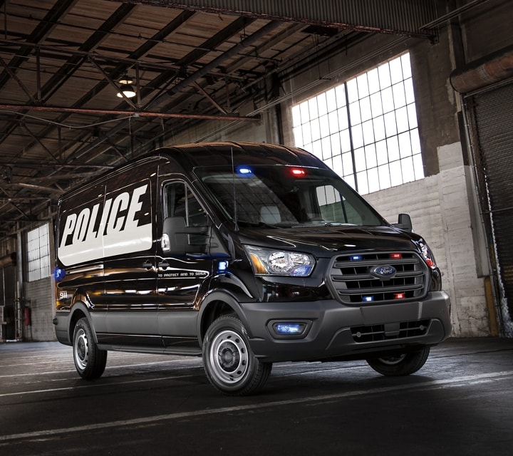 The twenty twenty ford transit prisoner transport vehicle parked in a garage