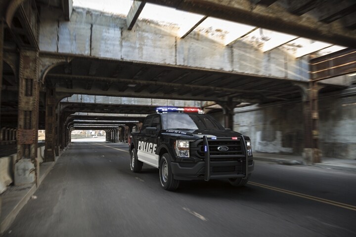 Twenty twenty one ford f one fifty special service vehicle being driven under a bridge
