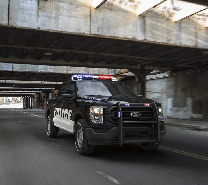 Twenty twenty one ford f one fifty special service vehicle being driven under a bridge