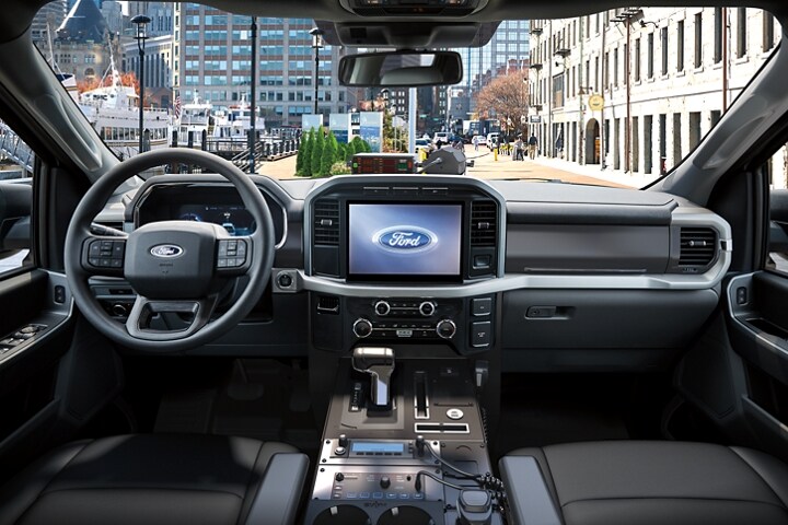 2023 Ford F-150®️ Lightning™️ Pro SSV interior front row seats, dashboard, rearview mirror and steering wheel