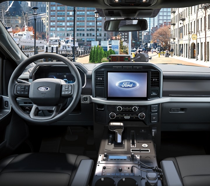 2023 Ford F-150®️ Lightning™️ Pro SSV interior front row seats, dashboard, rearview mirror and steering wheel
