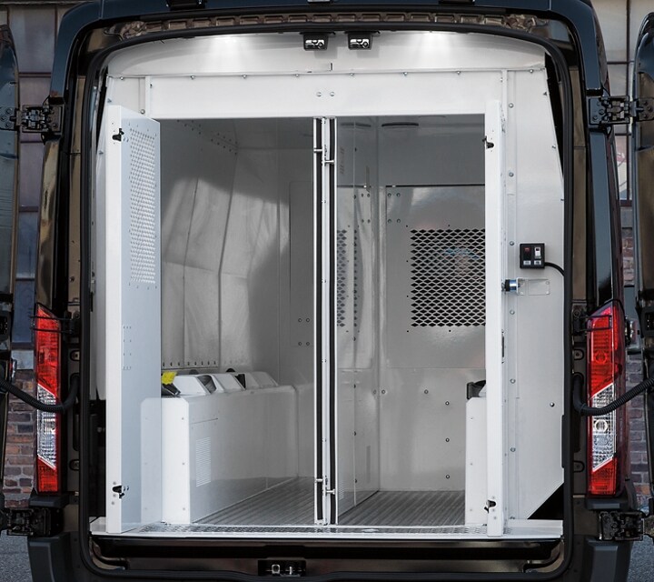 Open rear prisoner compartments in a twenty twenty ford transit prisoner transport vehicle 
