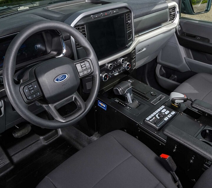 2023 Ford F-150®️ Lightning™️ Pro SSV front row seats and IP panel top tray for equipment mounting
