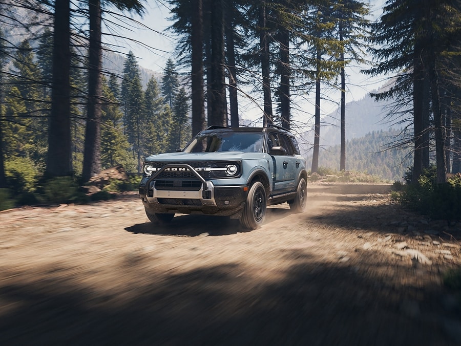A 2026 Ford Bronco Sport® being driven up hilly terrain