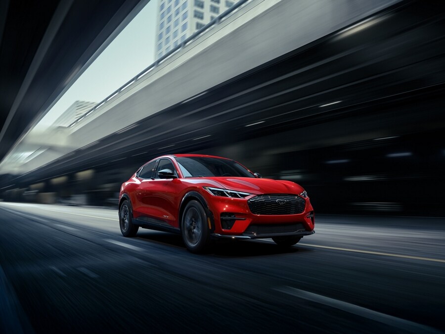 2026 Ford Mustang Mach-E® being driven down a city street